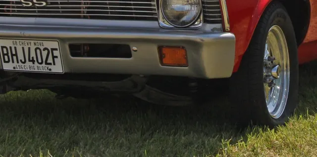 Local crop showing front stance and lower-body context on a modified 1968 Nova SS.
