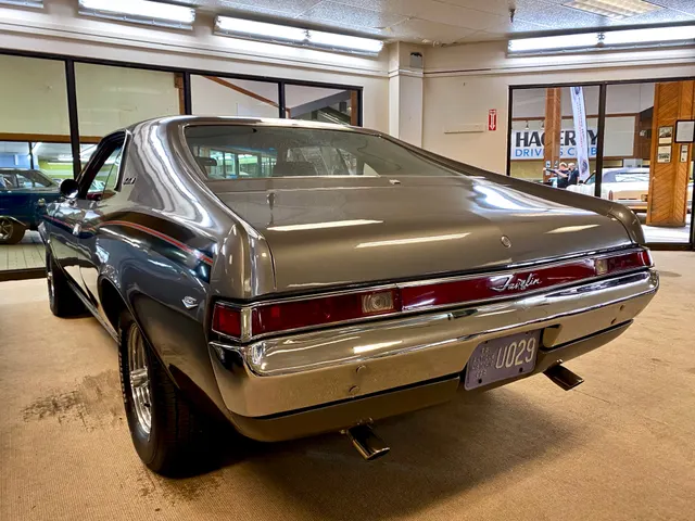 Exact-year Javelin SST rear three-quarter view retained for tail-panel, bumper, lamp, roofline, and body-proportion context; exhaust tips, tires, finish, and condition remain car-specific.