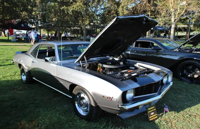 1969 Camaro Z/28 exterior at Camaro Generations Muscle Cars in the Park; related first-generation Z/28 context. Reused here only as related first-generation Z/28 visual context, not as a 1968-specific identity claim.