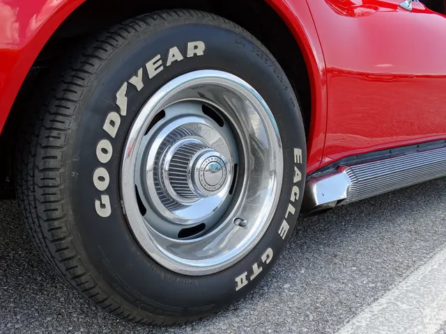 Rally-wheel detail on a 1969 Corvette. The modern Goodyear Eagle tire is later equipment and is not evidence of original tire fitment.
