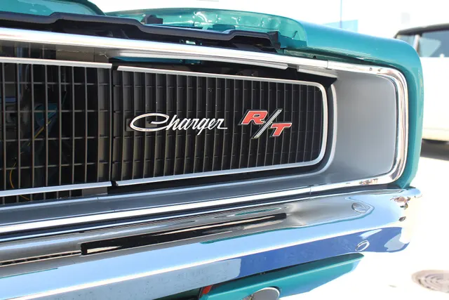 1969 Dodge Charger R/T 440 grille badge photographed by Jeremy from Sydney; reviewed as R/T grille and badge detail.