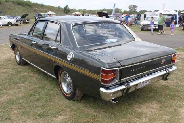 Exact-year restored XW GT display view retained for body, stance, paint, stripe, and model-year context; display claims require independent verification.