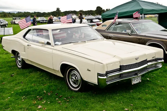 Exact-year view retained for body, trim, glass, lamps, bumpers, and wheel context; condition and restoration details remain specific to the photographed car.