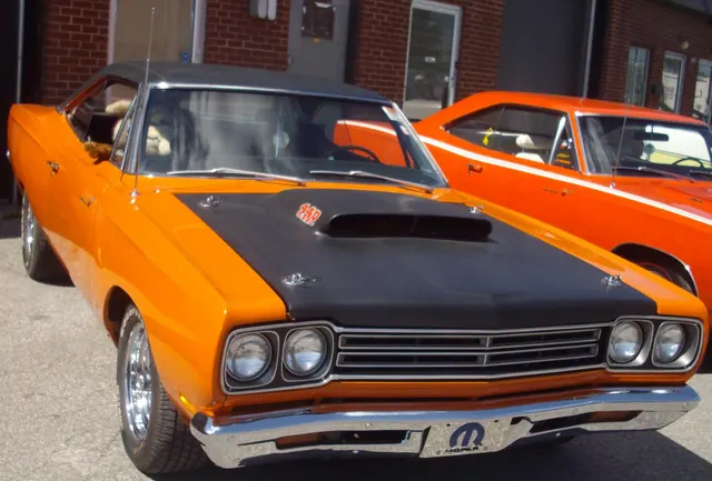 1969 Plymouth Road Runner at Auto classique Showtime Muscle Cars; front trim and stance context.