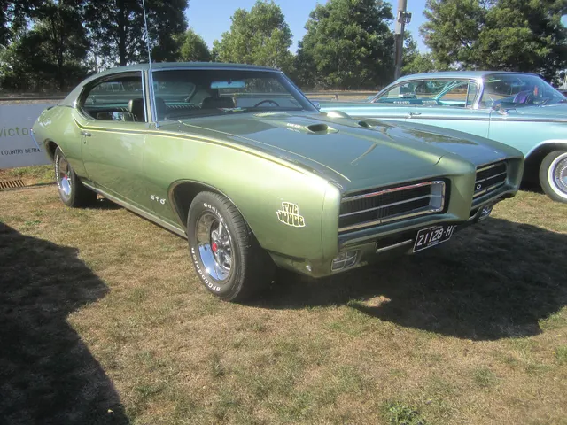 1969 Pontiac GTO Judge hardtop photographed by Sicnag; used for stripe, stance, and hardtop trim context.