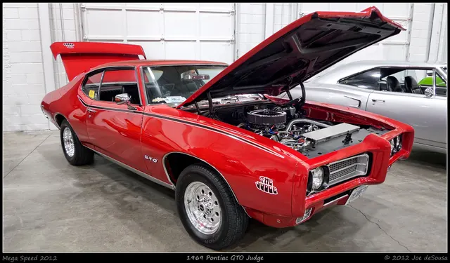 1969 Pontiac GTO Judge photographed by Mustang Joe; used as representative Carousel Red exterior context.