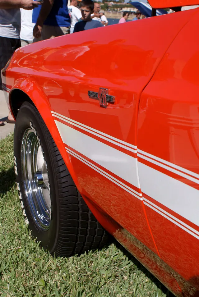 1969 Shelby GT500 428 Cobra Jet emblem detail; reviewed as representative 1969 Shelby GT500 media, not proof of any individual car originality.