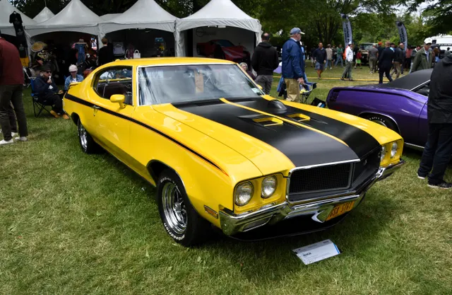 Front three-quarter view of a restored 1970 Buick GSX 455 Stage 1 in Saturn Yellow.