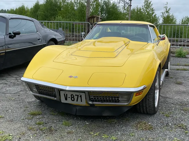 Restored yellow 1970 Corvette 454 coupe retained for big-block hood, body, and restoration context; markings are not proof of original LS5 equipment.