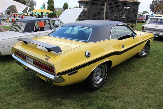 1970 Dodge Challenger R/T 440 Six Pack rear three-quarter view showing vinyl roof, stripe, and spoiler