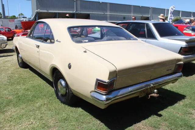Regular HG Monaro rear three-quarter view documenting the tail, pillar script, restrained trim, coupe roofline, and wheel covers.