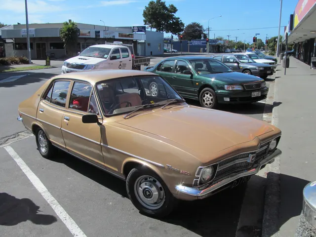 Regular 2600 SL four-door front three-quarter view documenting the long-nose six-cylinder body, grille, four-door cabin, restrained trim, and factory-style wheels.