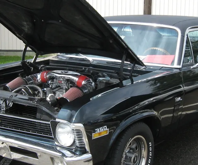 Local crop showing 1970 Nova SS front stance and wheel opening context.
