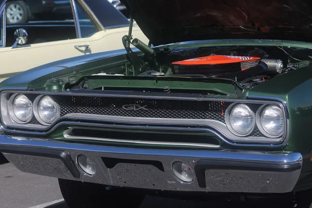 1970 Plymouth GTX grille and engine-bay context; component photo is context, not universal originality proof.