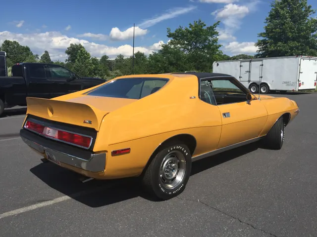 1971 AMC Javelin AMX 401 in Mustard Yellow; exact-model exterior context, not individual-car proof.
