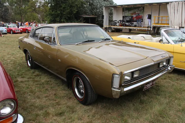 Exact-year Charger 770 318 front three-quarter view showing a stock-presenting regular body, grille, hood, wheels, glass, and trim; the engine application is based on the file record rather than visible proof.