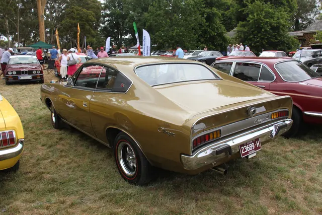 Rear three-quarter view of the same exact-year Charger 770 318 documenting the roofline, tail, script, lamps, bumper, and regular-body treatment.