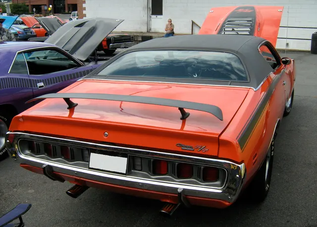 1971 Dodge Charger R/T rear view showing the full-width taillamp panel, rear spoiler, vinyl roof, and R/T badge