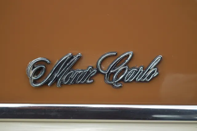 Licensed detail view of Monte Carlo script on a photographed 1971 SS coupe; trim context only.