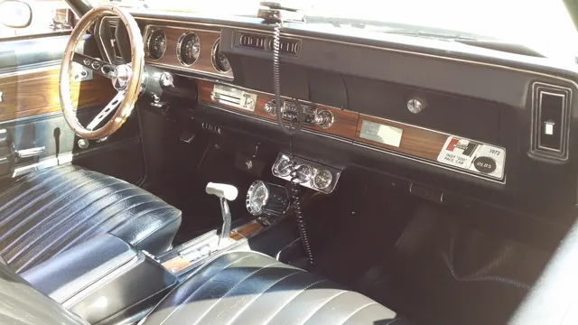 1972 Hurst/Olds interior view with black trim, console, instrumentation, and Hurst/Olds glove-box pace-car plaque context.