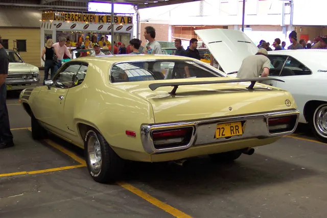 Rear three-quarter view of a stock-presenting 1972 Plymouth Road Runner, used for body, rear-panel, bumper, spoiler, and side-treatment context; the photograph does not establish a 400 drivetrain.