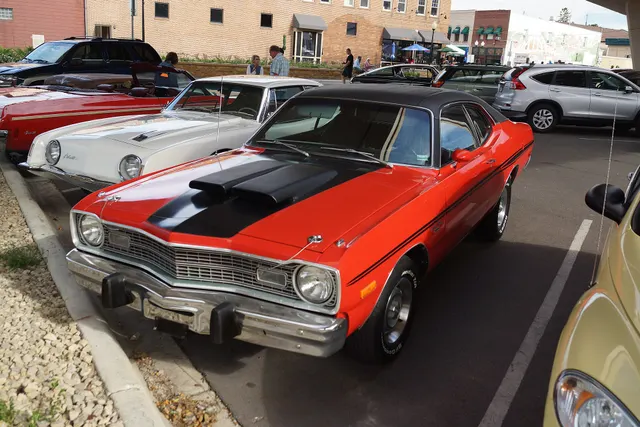 1973 Dodge Dart Sport front view showing the 1973 grille, bumper, hood treatment, and body-side stripe