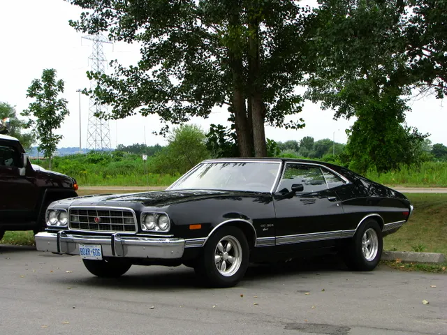 Black Gran Torino Sport SportsRoof; exact-model body view with aftermarket wheels