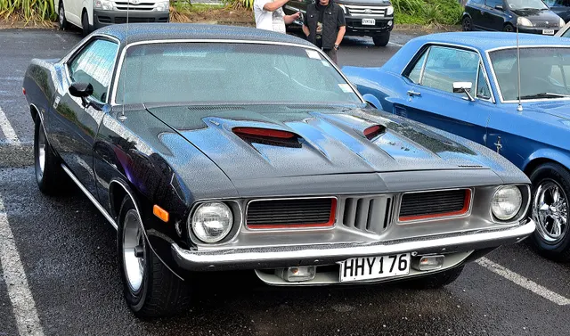 1973 Plymouth E-body front view showing the model-year grille, bumper guards, hood treatment, and stance