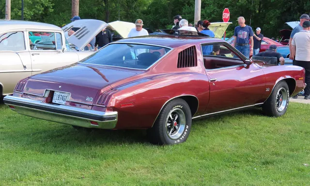 Exact-year view retained for body, trim, glass, lamps, bumpers, and wheel context; condition and restoration details remain specific to the photographed car.