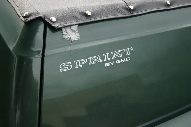 Exact-year tailgate detail retained for Sprint by GMC lettering and bed-cover attachment context; replaceable lettering cannot authenticate a car.