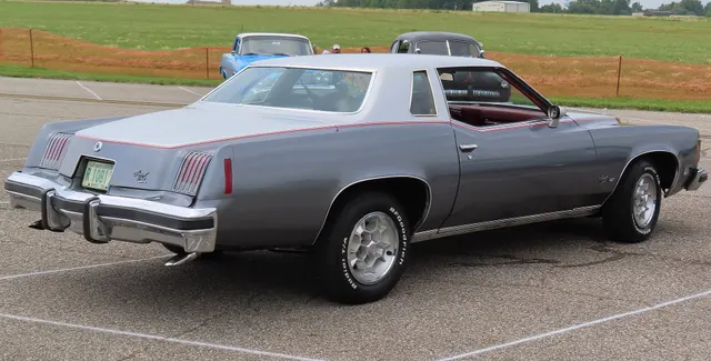Exact-year view retained for body, trim, glass, lamps, bumpers, and wheel context; condition and restoration details remain specific to the photographed vehicle.