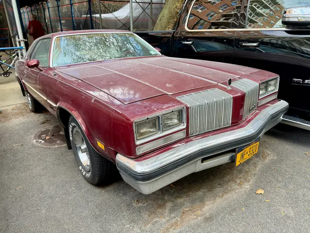 Exact-year view retained for body, trim, glass, lamps, bumpers, and wheel context; condition and restoration details remain specific to the photographed car.