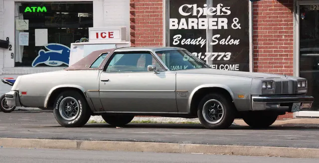 Exact-year view retained for body, trim, glass, lamps, bumpers, and wheel context; condition and restoration details remain specific to the photographed car.