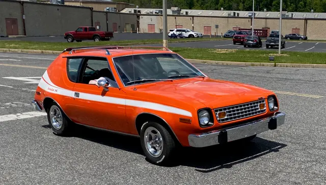 Exact-year view retained for body, trim, glass, lamps, bumpers, and wheel context; condition and restoration details remain specific to the photographed vehicle.