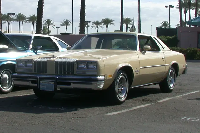 Exact-year view retained for body, trim, glass, lamps, bumpers, and wheel context; condition and restoration details remain specific to the photographed car.