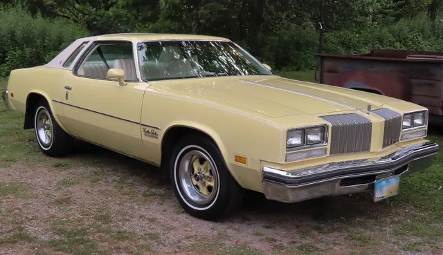 Exact-year view retained for body, trim, glass, lamps, bumpers, and wheel context; condition and restoration details remain specific to the photographed car.