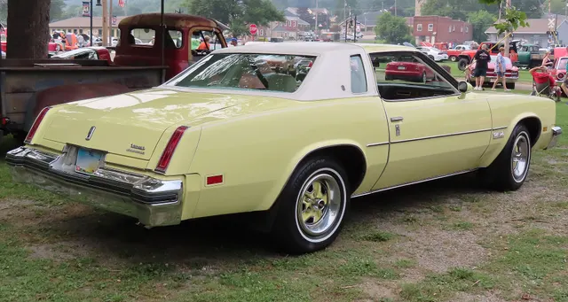 Exact-year view retained for body, trim, glass, lamps, bumpers, and wheel context; condition and restoration details remain specific to the photographed car.