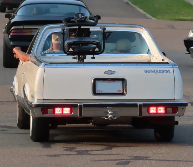 Exact-year Conquista retained for Antique White over Light Blue Poly paint, tailgate brightwork, and the Conquista decal; the bed-mounted mobility equipment, hitch, and other accessories are not presented as factory equipment.
