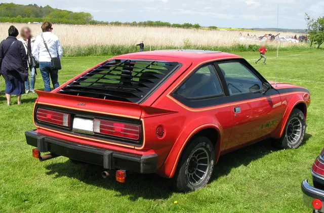 Exact-year view retained for body, trim, glass, lamps, bumpers, and wheel context; condition and restoration details remain specific to the photographed vehicle.