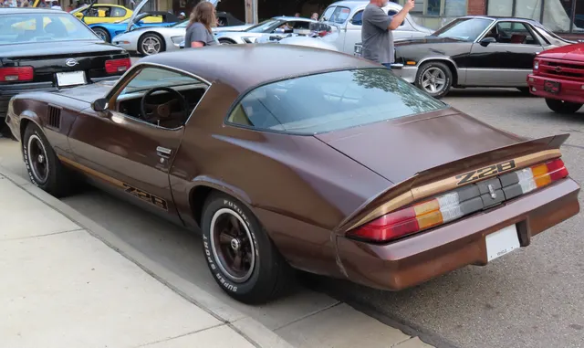 Exact-year Z28 retained for the rear body, spoiler, lamp panel, glass, wheel openings, body graphics, and stance; visible condition and restoration remain specific to this car.