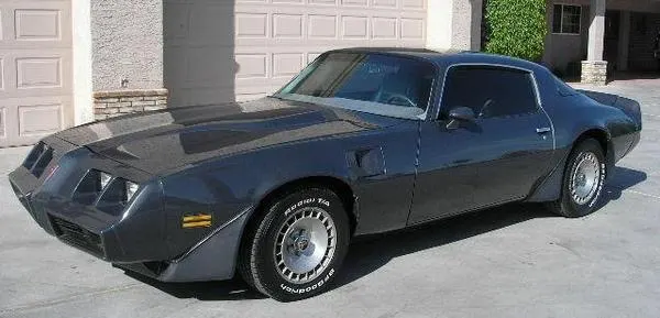 Exact-year Trans Am in basic exterior presentation retained for the body, nose, lamps, aero pieces, hood, glass, side profile, wheel openings, and non-hood-bird appearance context; condition remains subject-specific.