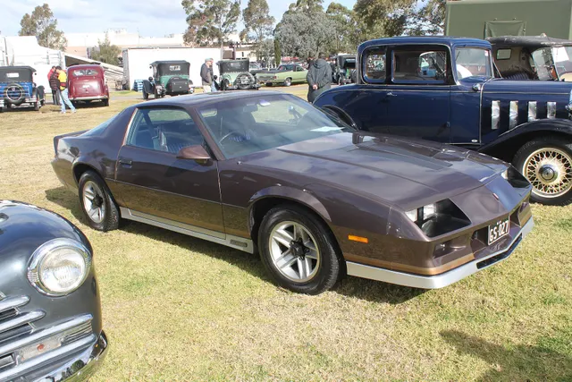 Exact-year view retained for body, trim, glass, lamps, bumpers, and wheel context; condition and restoration details remain specific to the photographed vehicle.