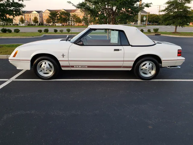 Exact-year 20th Anniversary convertible retained for Oxford White finish, red graphics, anniversary identification, soft top, body, and appearance-package context.