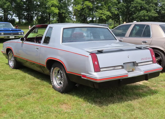 Exact-year view retained for body, trim, glass, lamps, bumpers, and wheel context; condition and restoration details remain specific to the photographed vehicle.