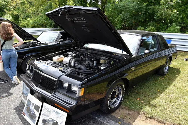 Exact-year Grand National with its hood open, retained for LC2 engine-bay layout, intercooler and charge plumbing, air cleaner, accessory drive, brake assist, cooling, firewall, labels, and service context; direct inspection controls individual components.
