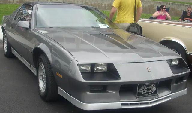 A photographed 1986 Camaro showing a stock-presenting front body, nose, hood, glass, lamps, and factory-style wheel context; trim, equipment, condition, and individual-car originality remain specific to this car.