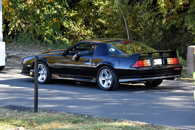 Modified 1986 Camaro Z28 retained only as individual-car restoration context; aftermarket wheels, stance, and body treatment are not representative factory identity evidence.