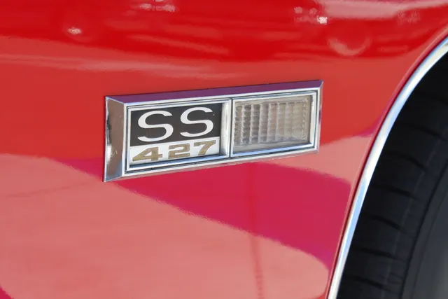 Licensed SS427 fender badge detail from a 1968 Impala SS427; visual cue only, not standalone proof.