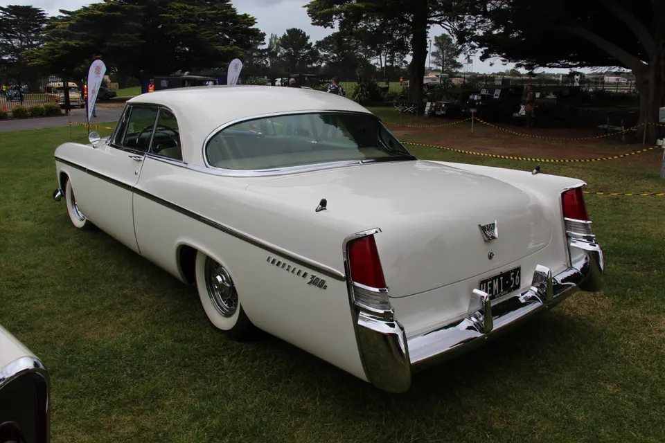 Upswept rear fins with tall integrated tail lamps profile photo