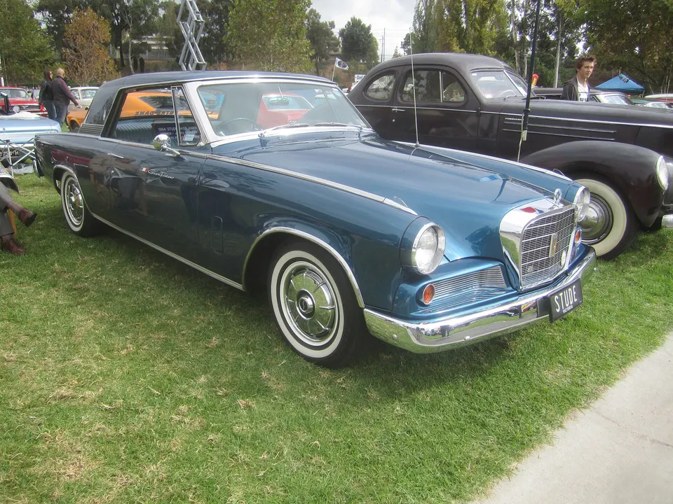 Smooth final-year deck lid with chrome Studebaker Hawk script and fully chromed tail-lamp housings profile photo